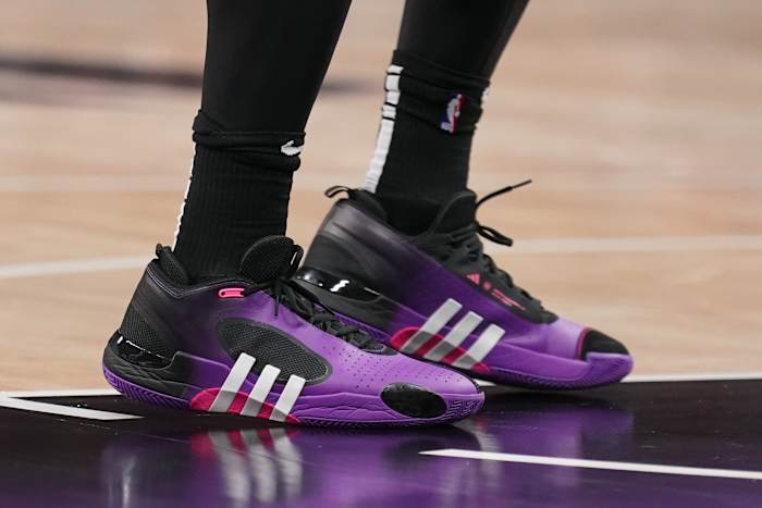 Cleveland Cavaliers guard Donovan Mitchell's purple and black adidas sneakers.